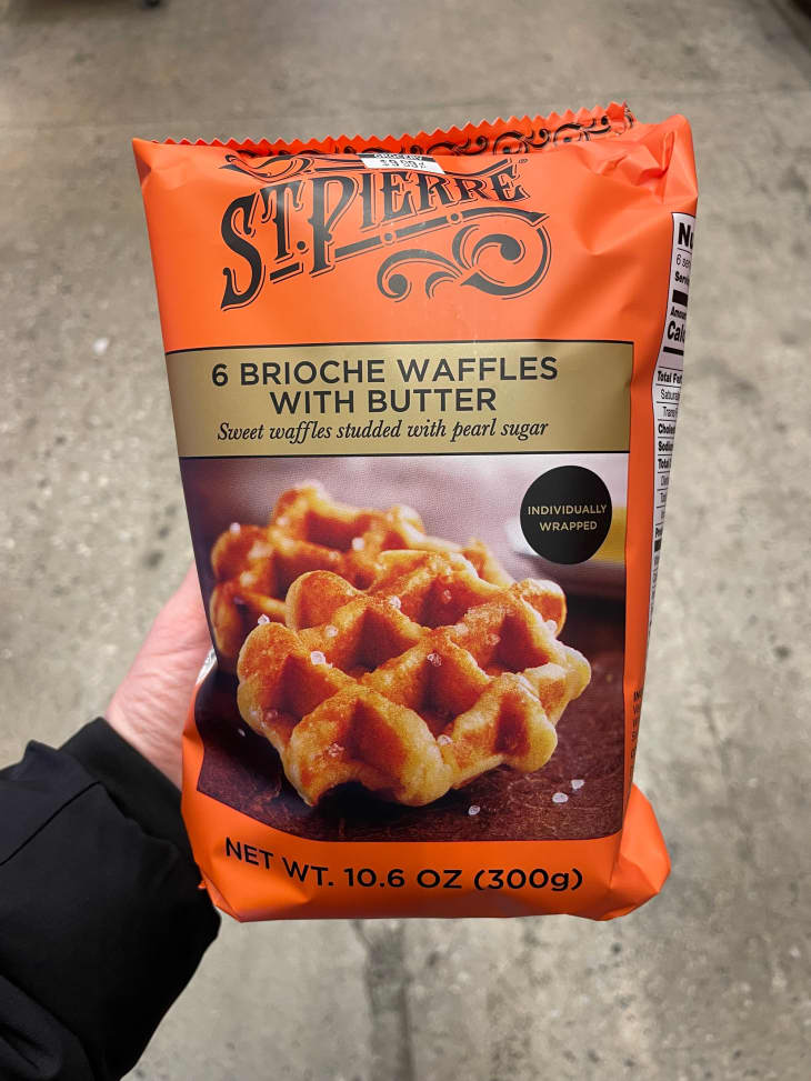 Someone holding St. Pierre Brioche waffles.