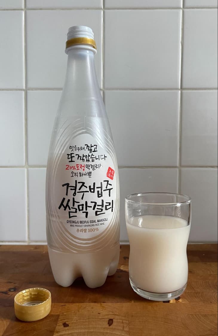 Gyeongju Beopju Makgeolli bottle with some in glass