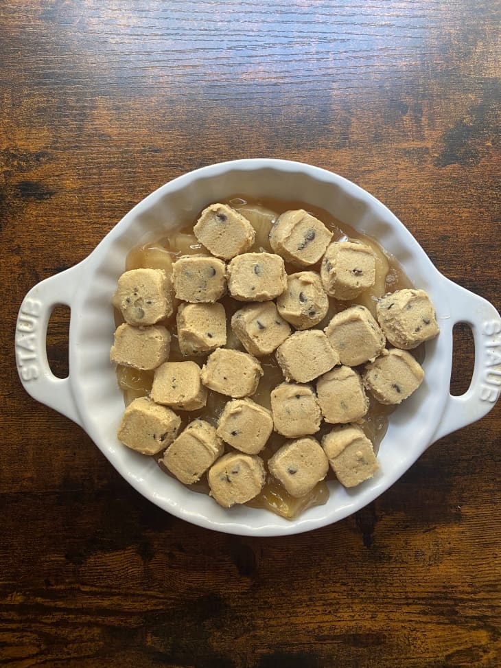 Chocolate chip cookie dough on top of apple crisp.