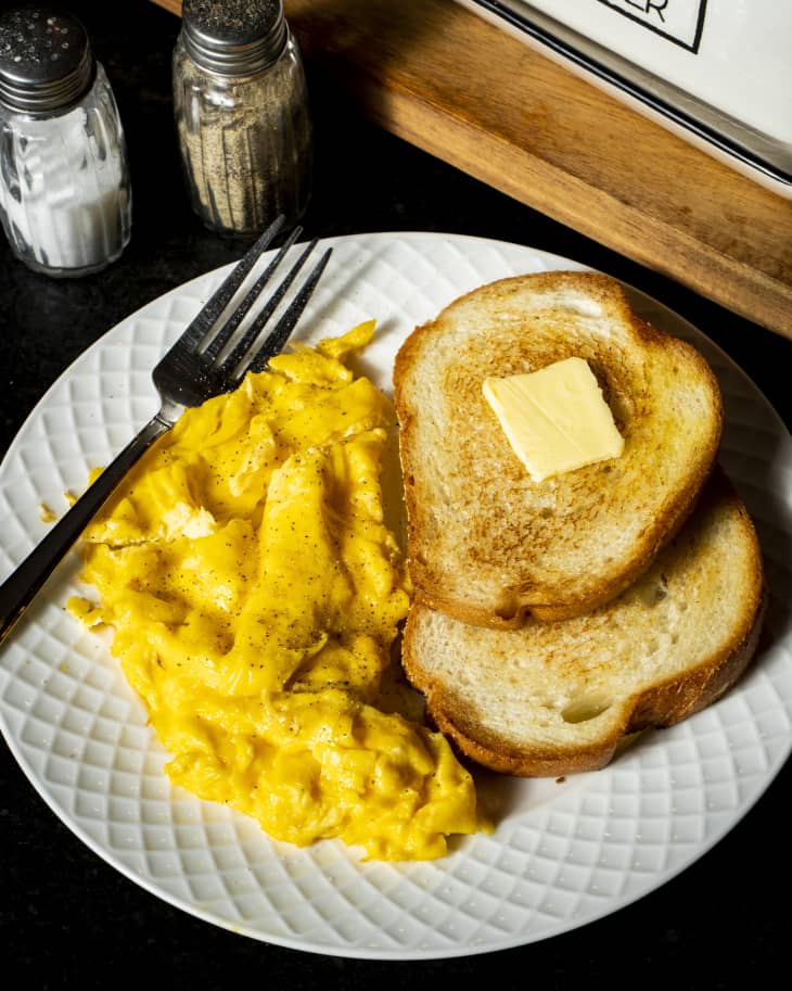 Fluffy scrambled eggs with buttered toast