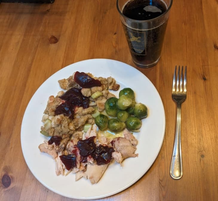 Turkey with brussel sprouts and stuffing with cranberry sauce