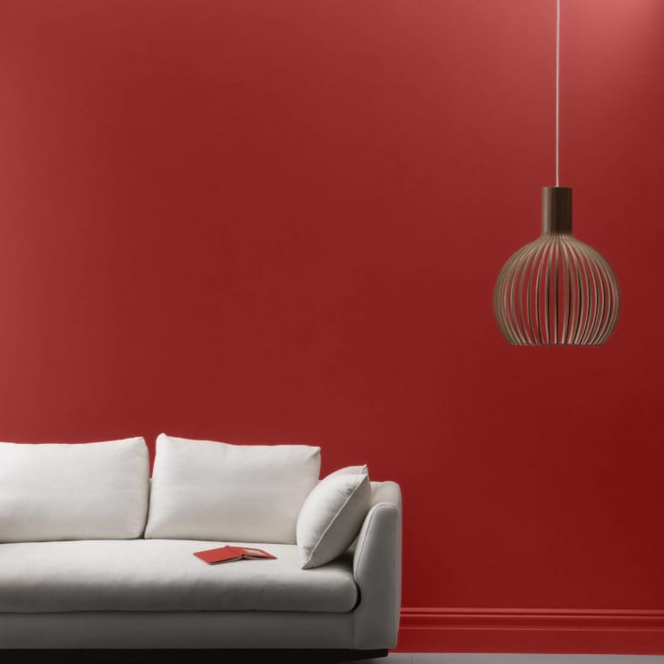 Red glossy paint with white couch