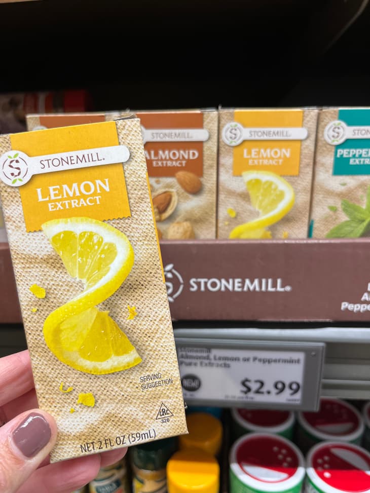 Someone holding lemon extract.