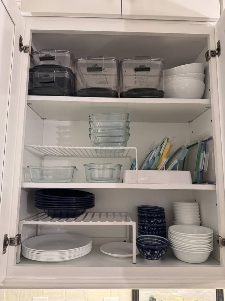 Cabinets with items such as plates and bins.