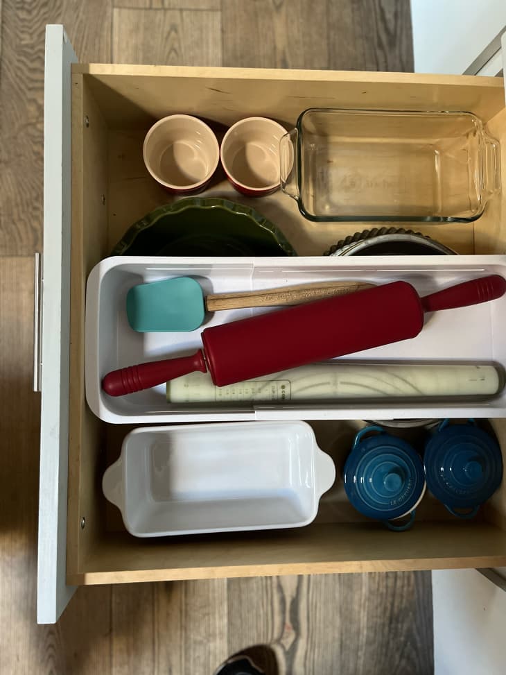 Neatly organized kitchen drawer with YouCopia DrawerFit Sliding Drawer Bin inside.