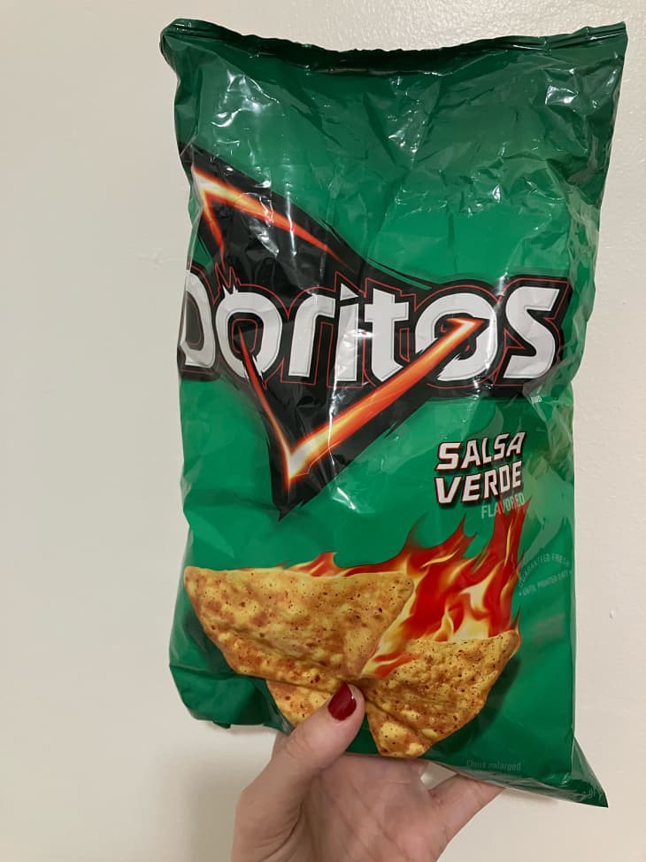 Someone holding bag of Salsa Verde Doritos