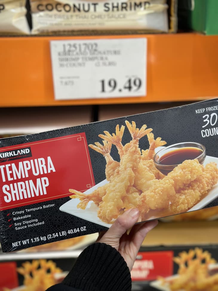 Someone holding package of Costco's tempura shrimp.