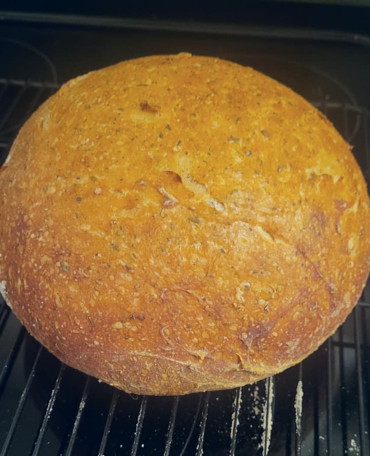 loaf of herb bread on oven rack