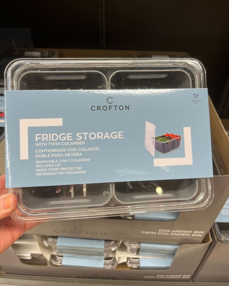 someone holding up Crofton Fridge Storage containers from Aldi