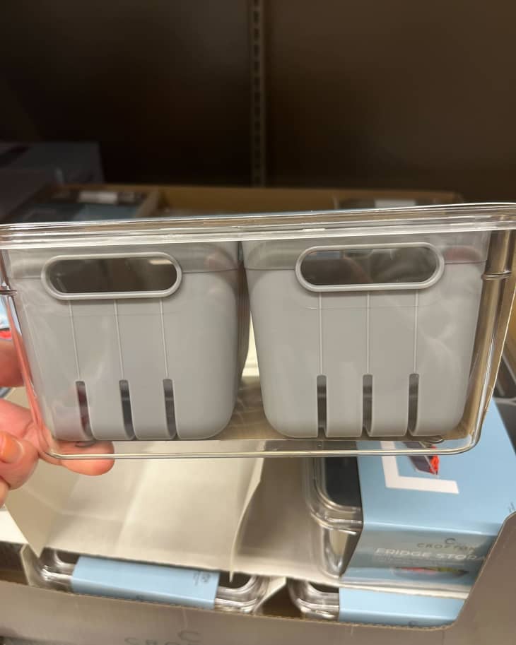 someone holding up Crofton Fridge Storage containers from Aldi