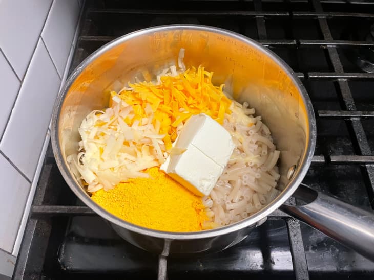 Mac and cheese ingredients in a pan.