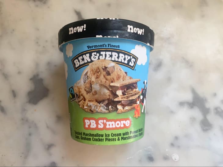 Pint of Ben &amp; Jerry’s PB S’more Toasted Marshmallow Ice Cream on marble counter