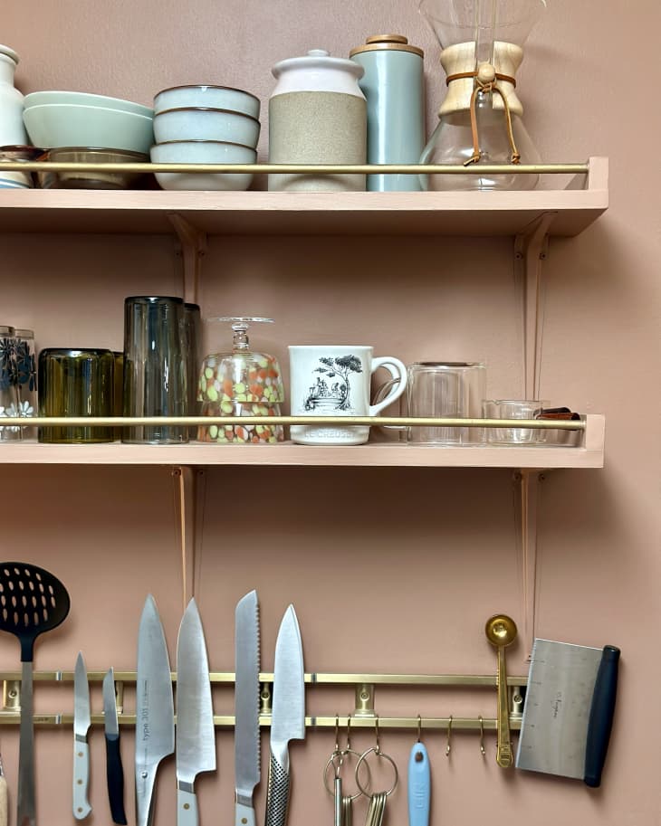 terracotta kitchen with wood shelves, gold cabinet pulls after refresh