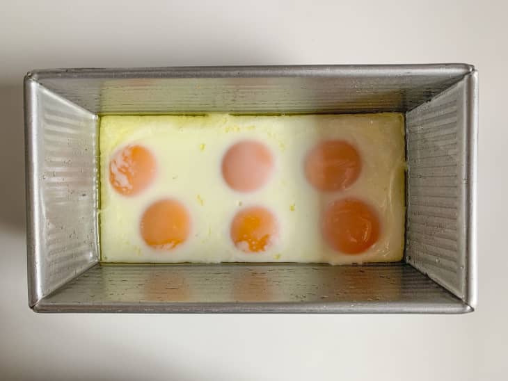 Eggs baked in a metal rectangular pan.