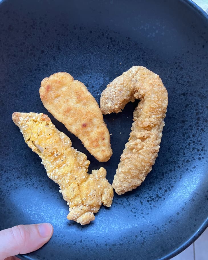 Various chicken fingers on plate.