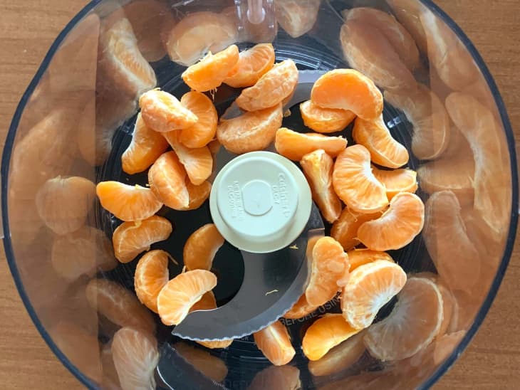 Tangerine sections in a food processor before processing