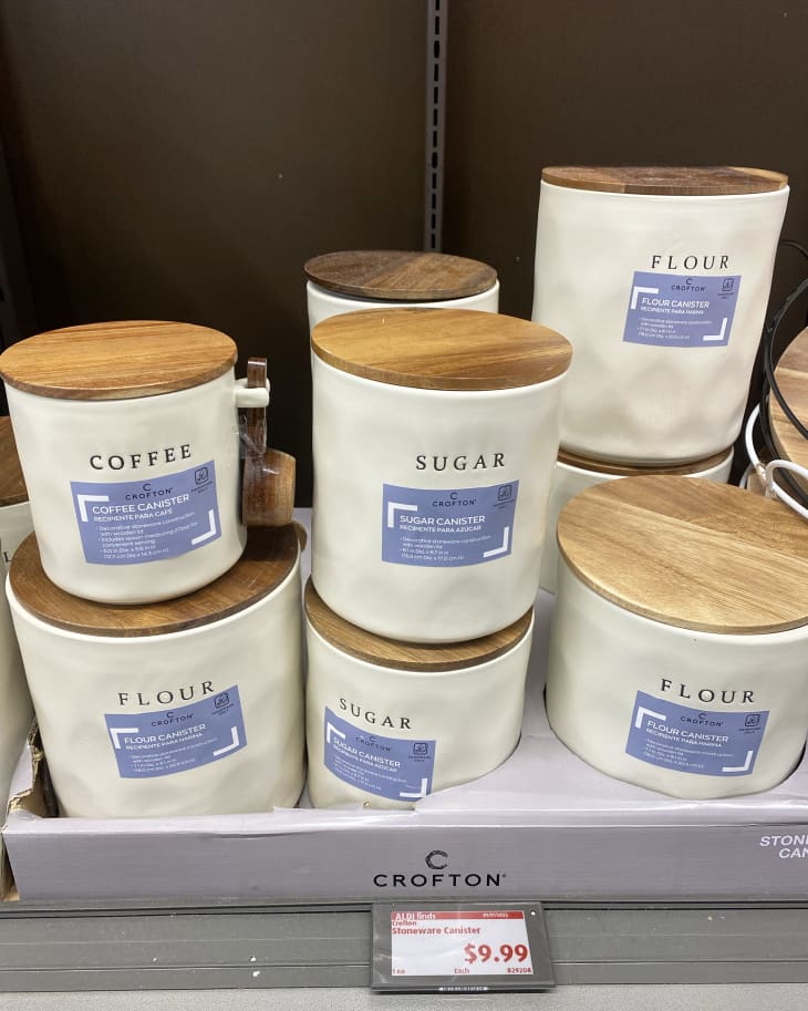 Aldi organizing canisters in store