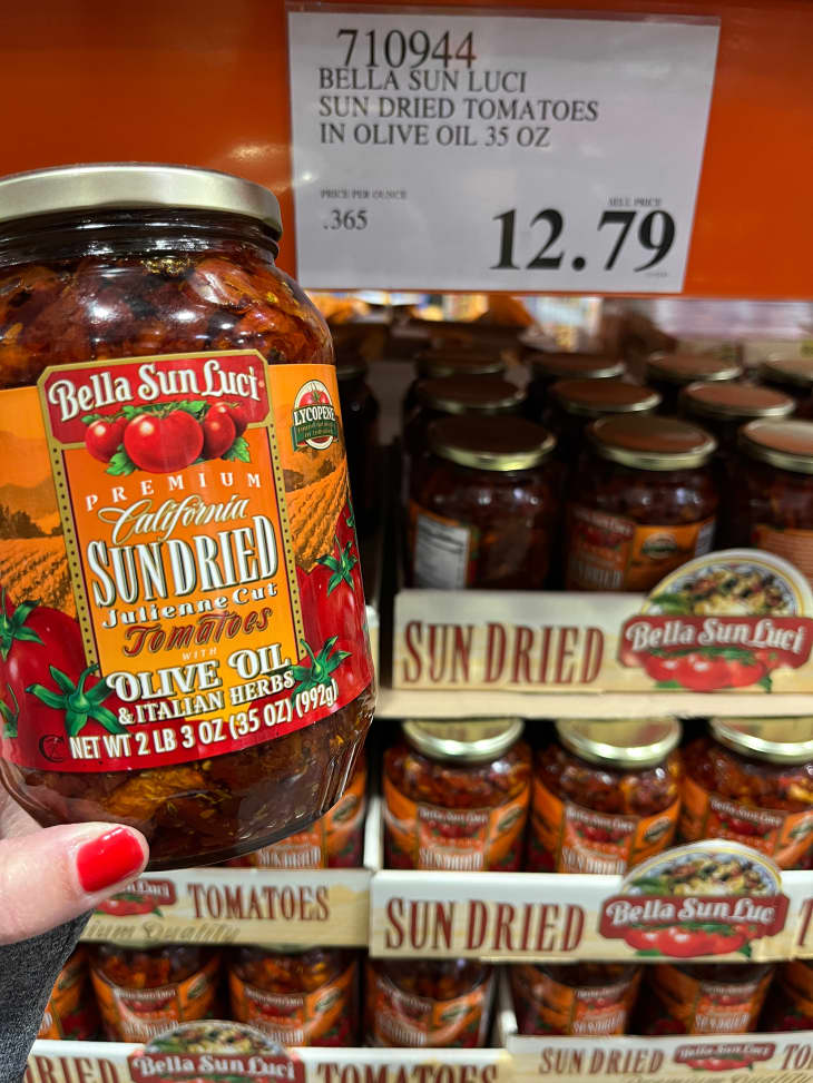 Someone holding Costco's sun dried tomatoes.