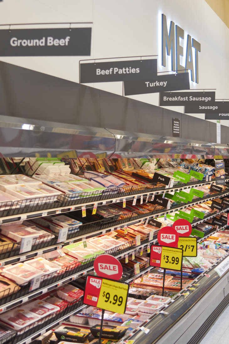 grocery isle with packed shelves of  meat