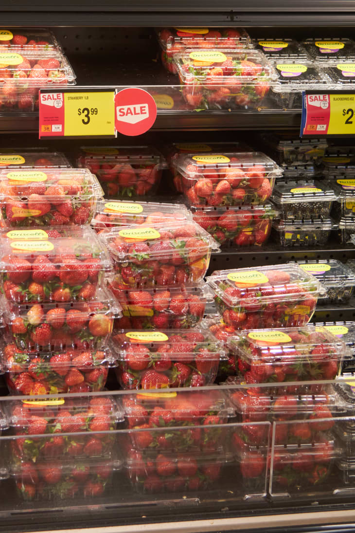 strawberries on shelves in grocery store
