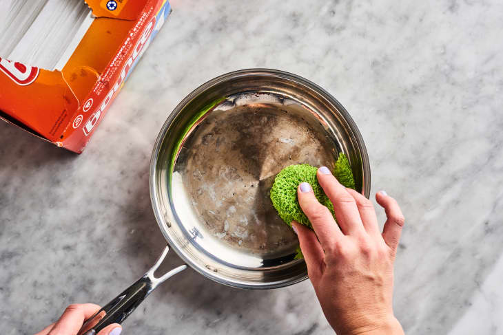 Rubbing a clean pan, box of dryer sheets