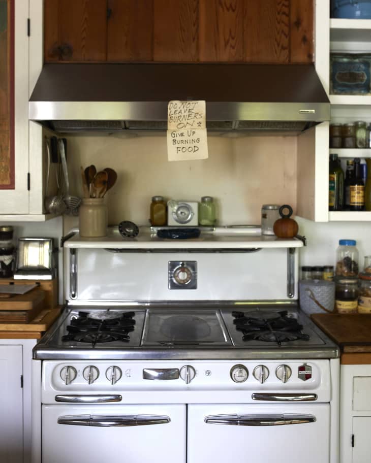 Joan's stove has a note sticking to the oven hood.