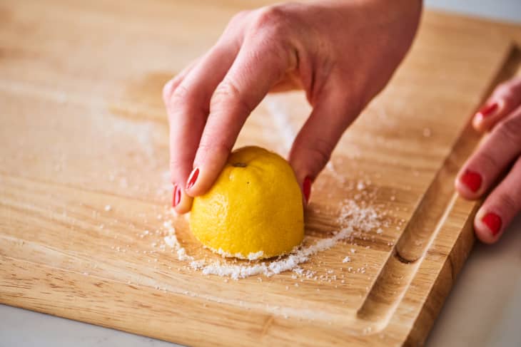 using salt and a lemon half to clean a wood cutting board