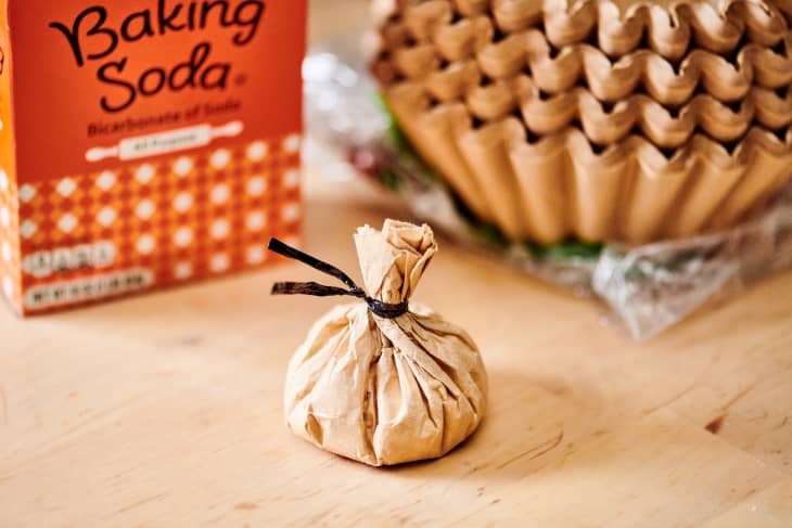 Coffee filter with baking soda tied up with a twist tie