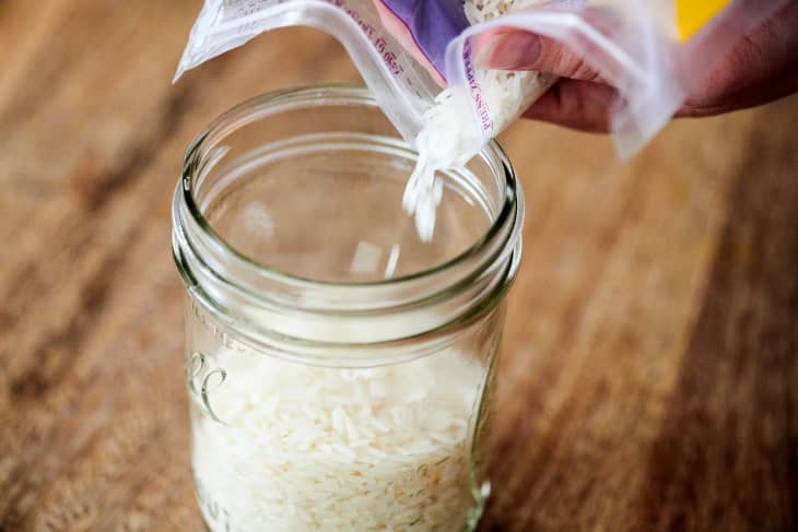 Pouring rice into a mason jar