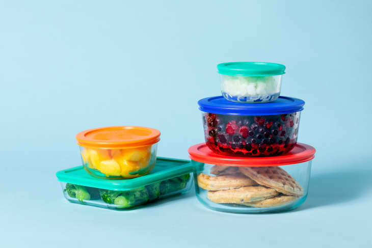 food storage containers with frozen food stacked