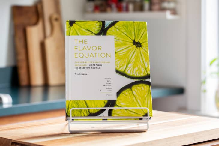 Cover of The Favor Equation by Nik Sharma displayed on book stand.
