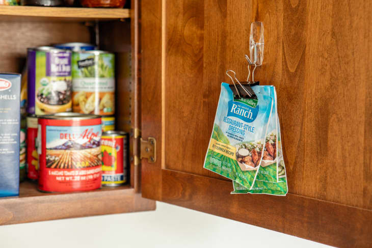 Ranch packet hanging on binder clip in pantry.