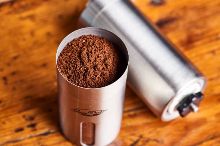 coffee grinds sit in a coffee grinder