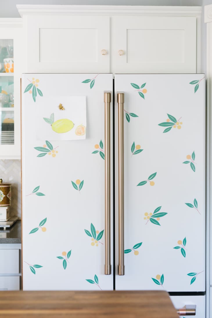 Refrigerator wrapped in flower motif contact paper.