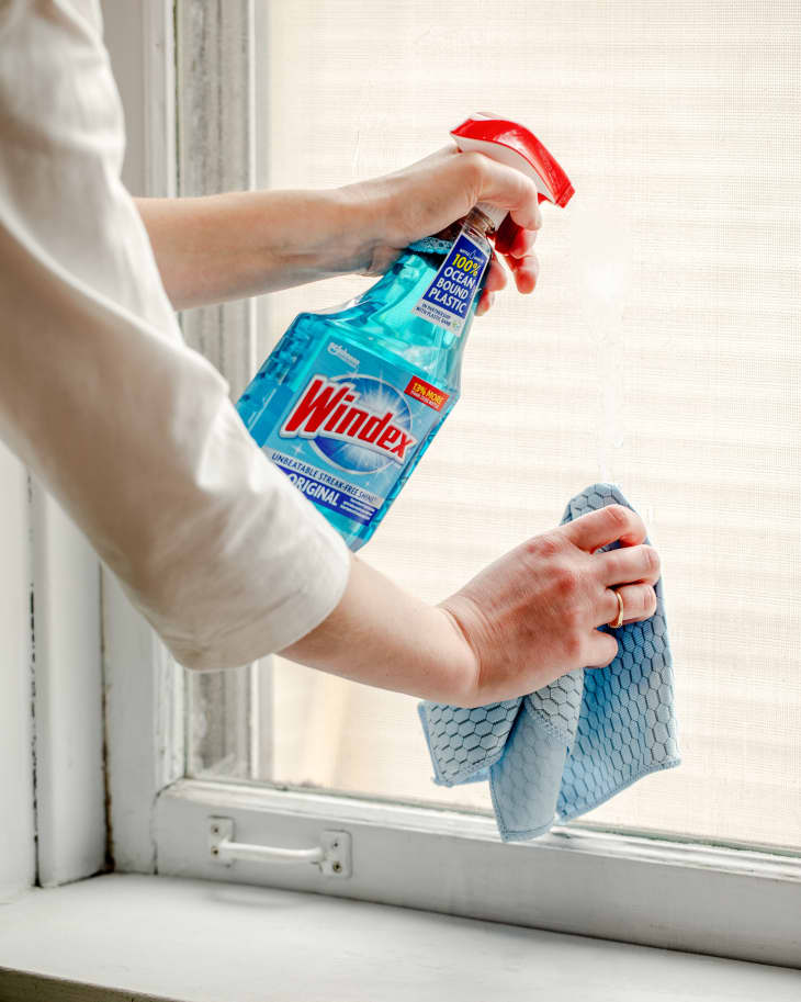 Cleaning window with Windex + microfiber cloth