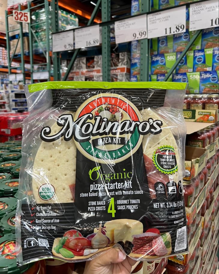 Someone holding up a package of Molinaro’s Organic Pizza Starter Kit in Costco store