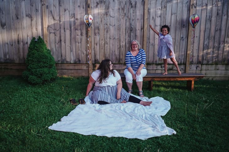 Liz, her mom, and her daughter in the backyard