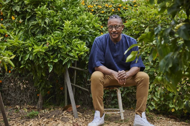 gregory gourdet in front of plants