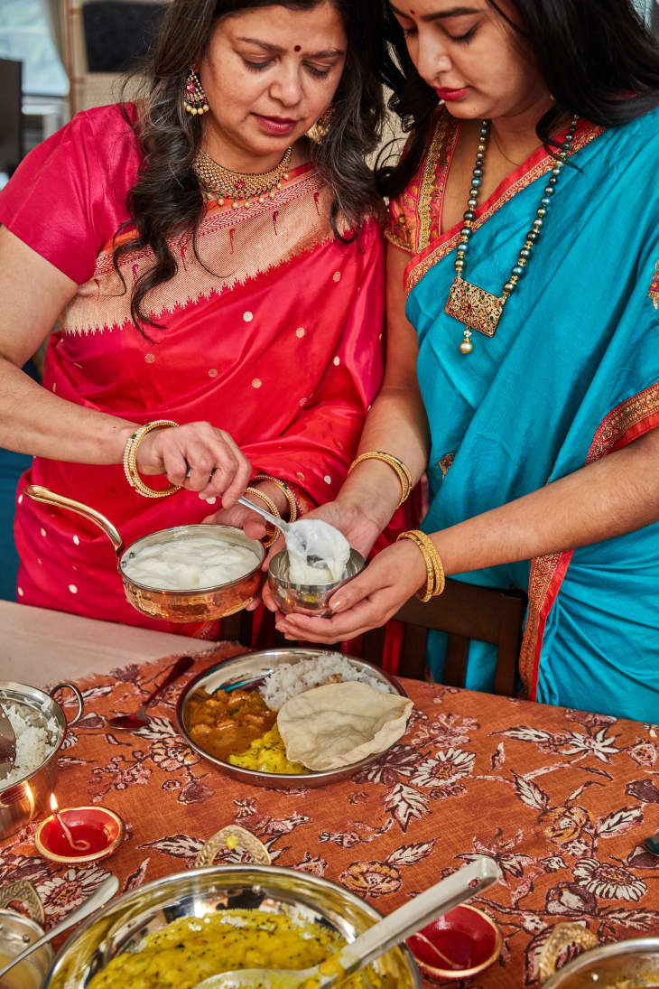 Shreya and mom Anu making dinner.