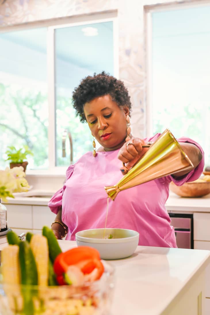 Nicole Taylor cooking in kitchen