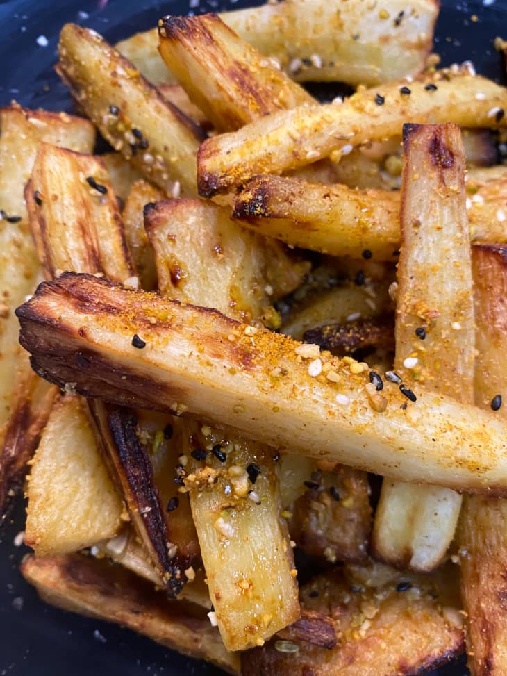 A  closeup of roasted parsnips with spices on top