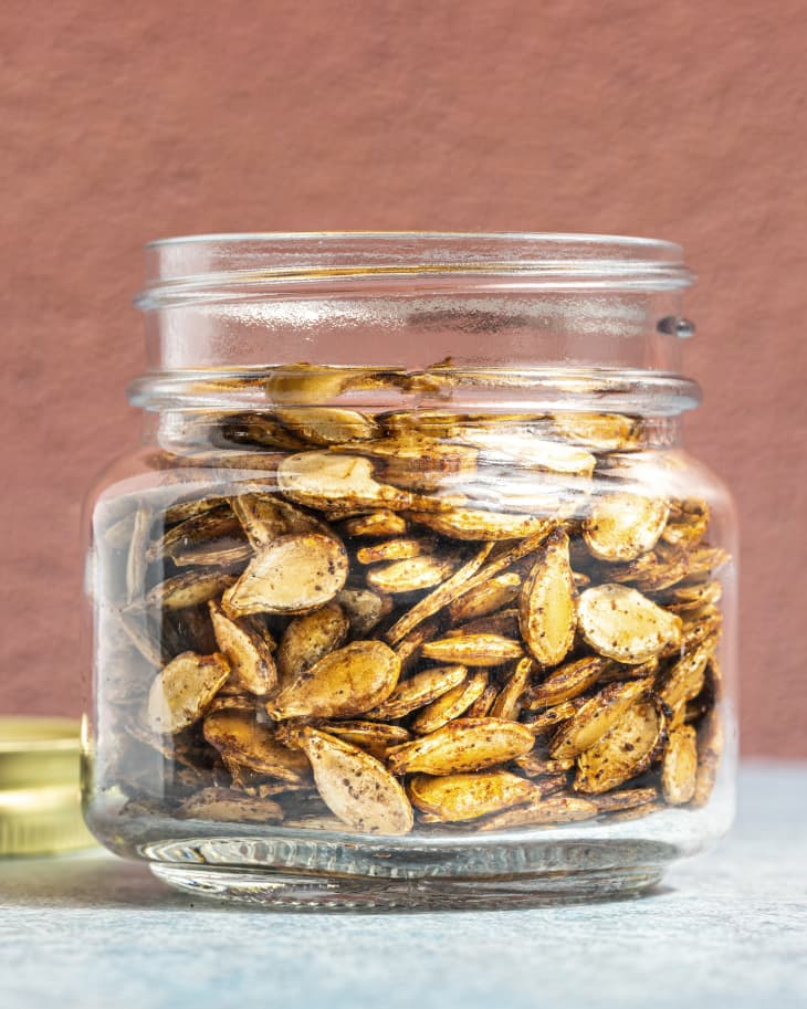 Air fryer pumpkin seeds in a glass jar