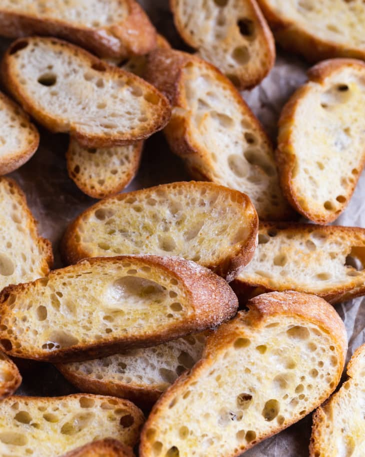 Crostini (crusty bread brushed with olive oil, sliced and toasted in the oven or in the grill)