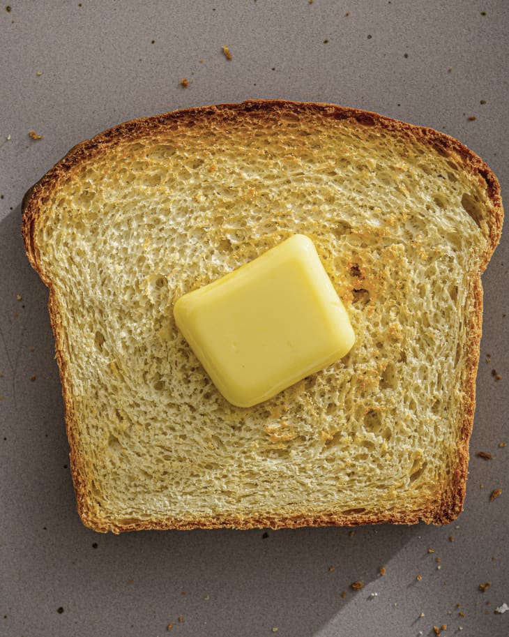 a slice of potato bread with a pat of butter on it.