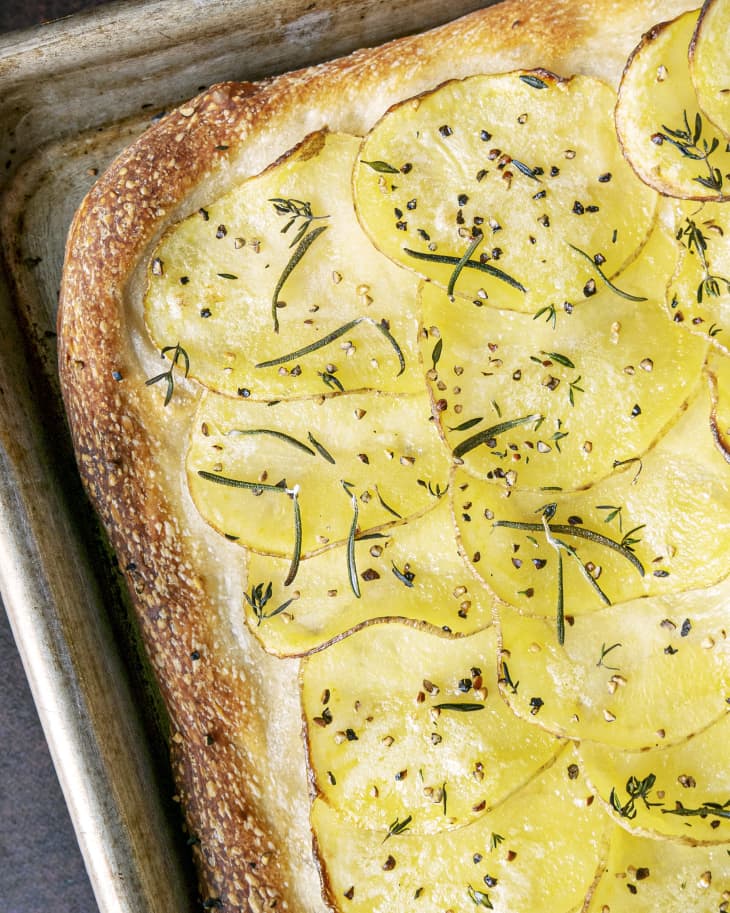 Potato bread  (thinly sliced potatoes baked into bread) in a pan with a hearty crust