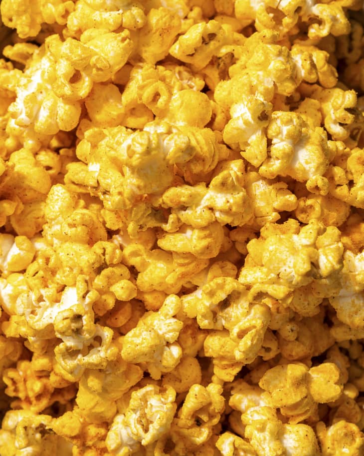a closeup of popcorn covered in cheese powder