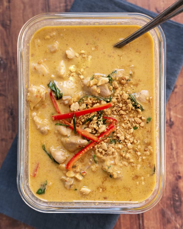Panang curry (a type of red Thai curry that is thick, salty and sweet, with a zesty makrut lime flavor) in a glass baking dish.