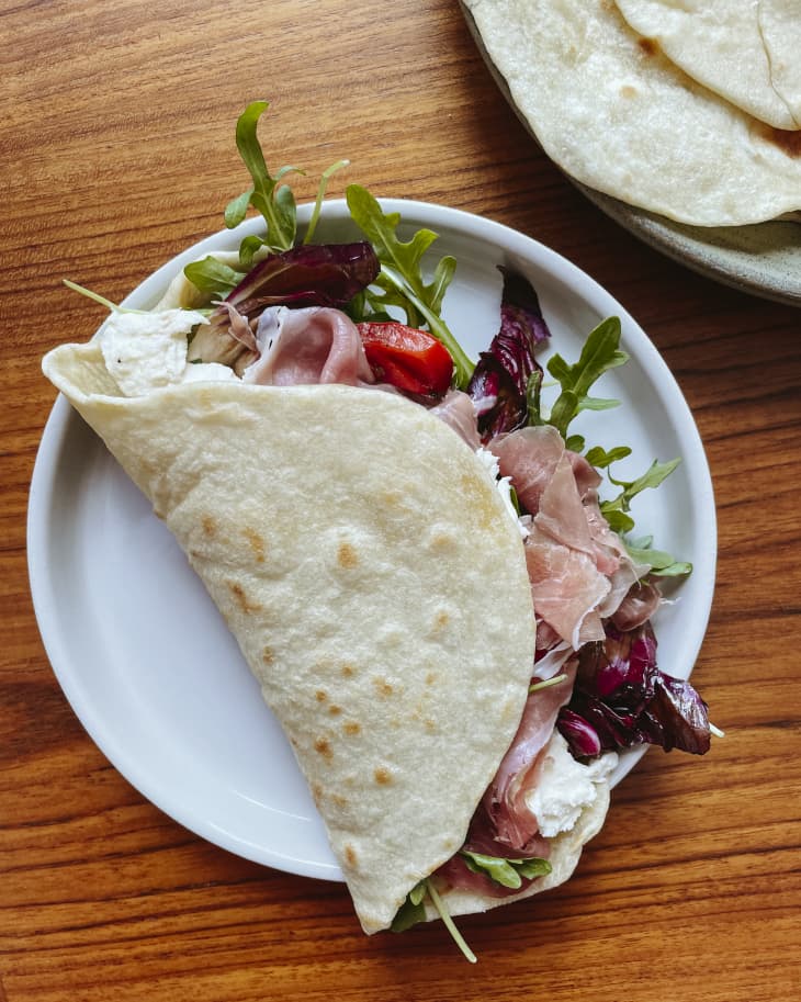 Piadina (a rustic Italian sandwich, prepared with dough cooked fresh on a griddle and typically filled with a variety of meats, cheese and vegetables)