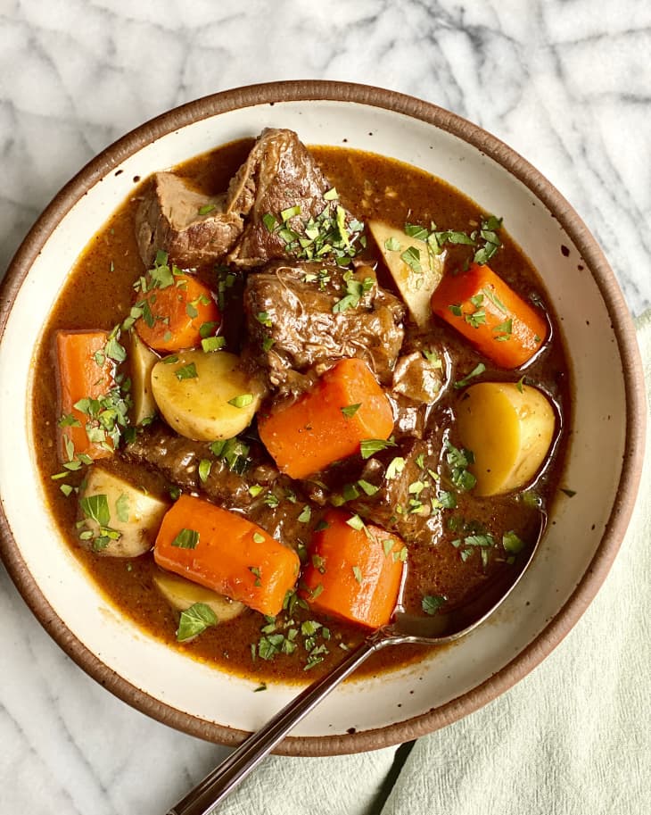 beef stew with carrots and potatoes in a bowl