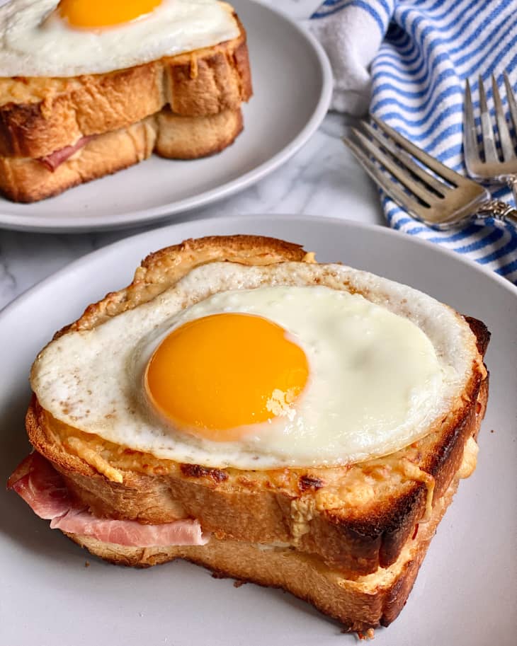 an over easy egg on two pieces of toast